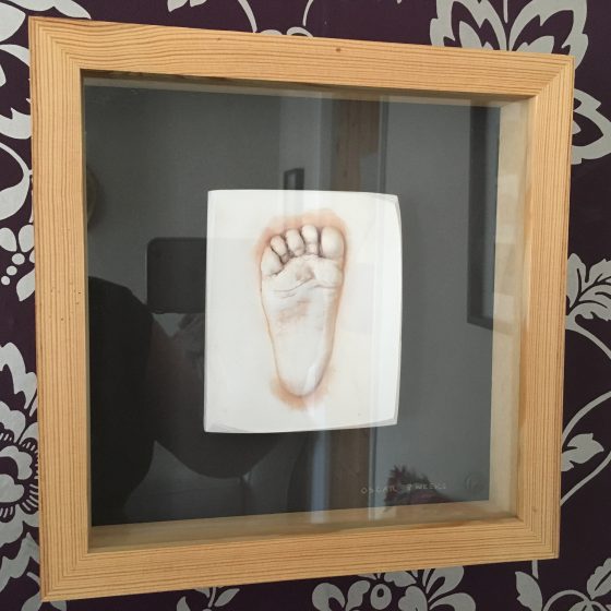 A cast of Oscar's 8 week old footprint. A proper first Father's Day gift.